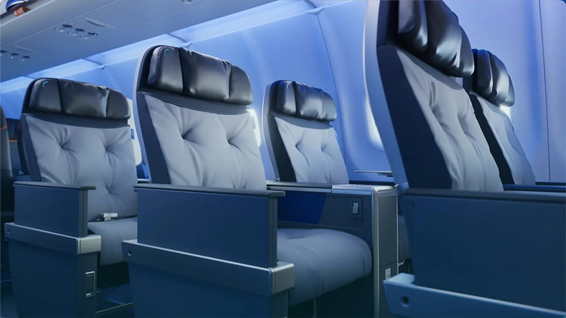 Rows of JetBlue BlueFirst first-class seats in an aircraft cabin