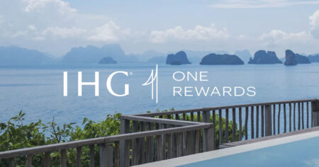 A scenic view of the ocean with the IHG One Rewards logo