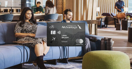 A man and woman sitting in an airport lounge, with a Citi / AAdvantage Executive World Elite Mastercard card displayed over the image