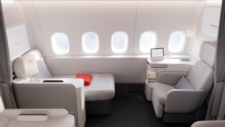 Air France La Première suite with armchair and chaise longue along five cabin windows